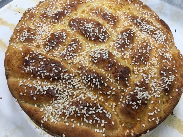Braided Challah Loaf on a white plate