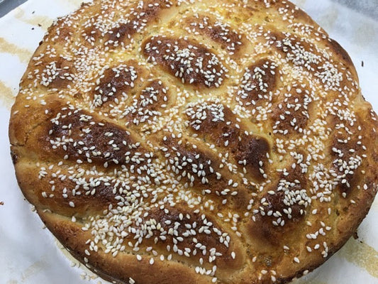 Braided Challah Loaf on a white plate